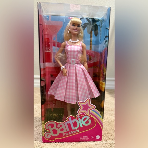 barbie doll in pink gingham dress Barbie in Pink Gingham Dress Barbie The Movie